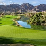 Panoramic view of a lush green golf course at PGA WEST Private Clubhouse & Golf Courses. Smooth