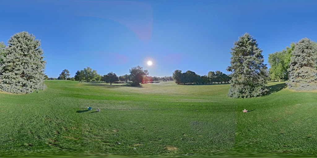 Panoramic view of a lush green golf course at Paganica Golf Course. Smooth