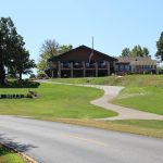 Panoramic view of a lush green golf course at Palmer Hills Golf Course. Smooth