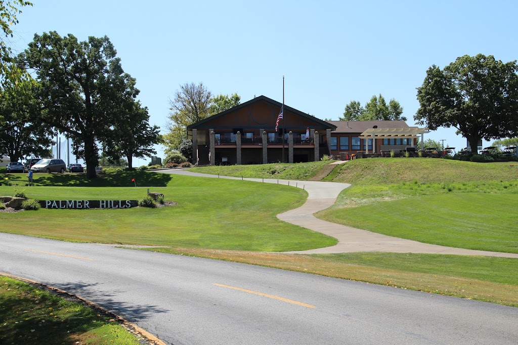 Panoramic view of a lush green golf course at Palmer Hills Golf Course. Smooth