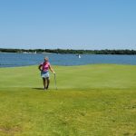 Panoramic view of a lush green golf course at Paradise Pointe. Smooth