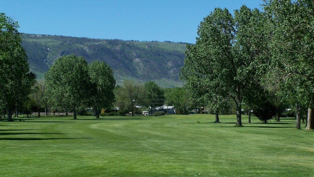 Panoramic view of a lush green golf course at Paradise Valley Country Club. Smooth