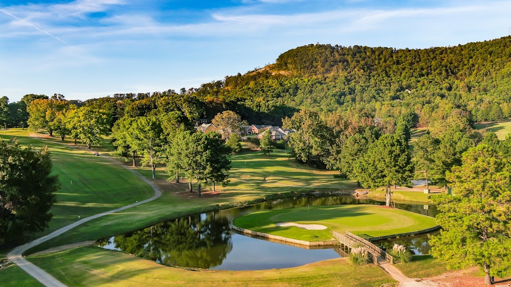 Panoramic view of a lush green golf course at Paris Mountain Country Club. Smooth