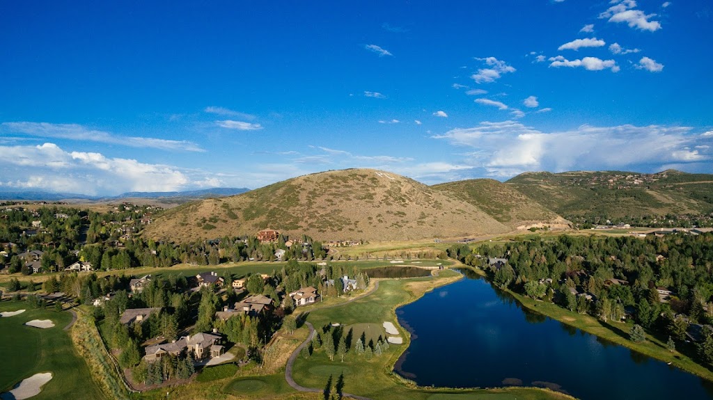 Panoramic view of a lush green golf course at Park Meadows Country Club. Smooth