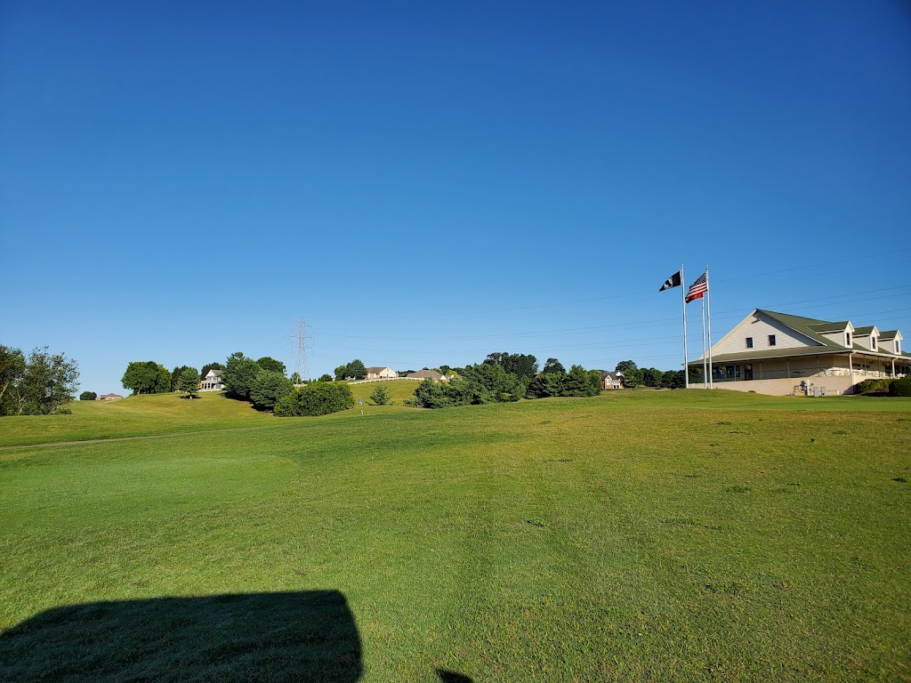 Panoramic view of a lush green golf course at Patriot Hills Golf Club. Smooth