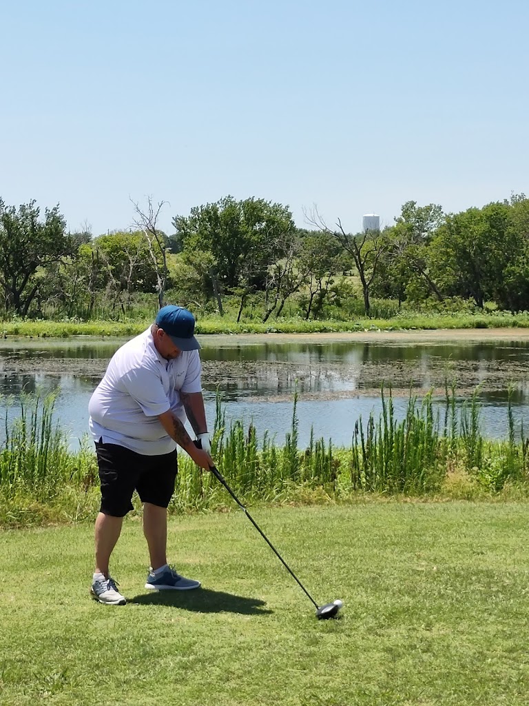 Panoramic view of a lush green golf course at Pauls Valley Golf Course. Smooth