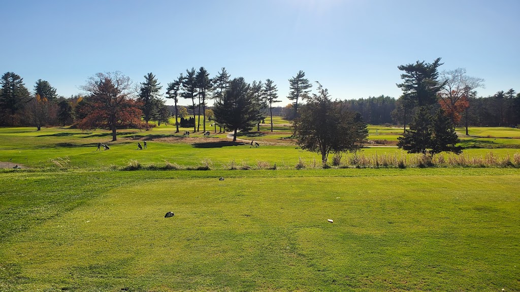 Panoramic view of a lush green golf course at Pease Golf Course. Smooth