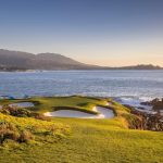 Panoramic view of a lush green golf course at Pebble Beach Golf Links. Smooth