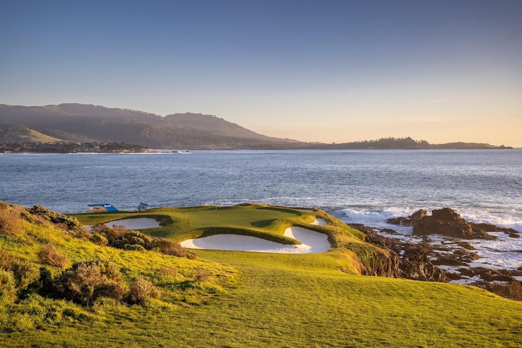 Panoramic view of a lush green golf course at Pebble Beach Golf Links. Smooth