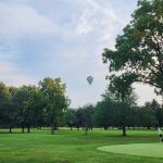 Panoramic view of a lush green golf course at Pebble Brook Golf Club | 36-Hole Public Course | Indoor Simulators | Grill & Bar | Events & Meetings. Smooth