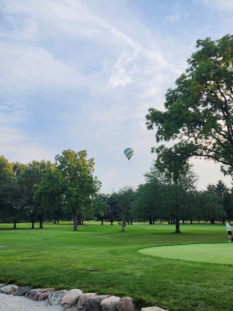 Panoramic view of a lush green golf course at Pebble Brook Golf Club | 36-Hole Public Course | Indoor Simulators | Grill & Bar | Events & Meetings. Smooth