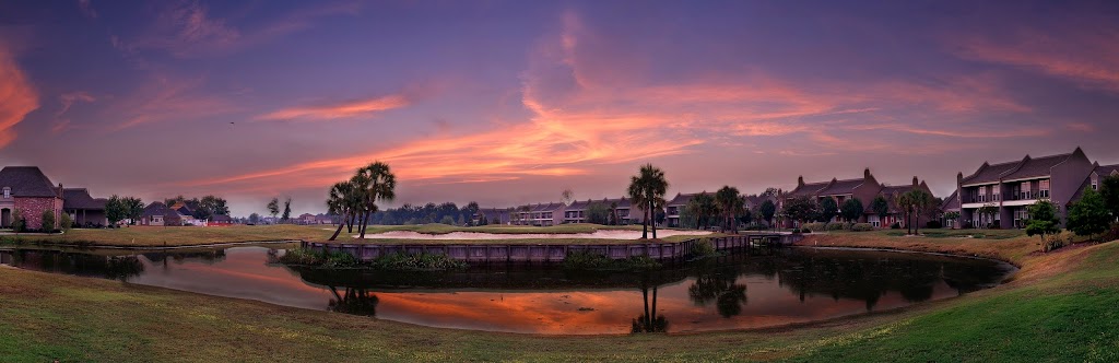 Panoramic view of a lush green golf course at Pelican Point Golf & Country Club. Smooth