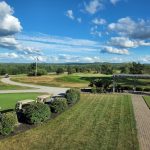 Panoramic view of a lush green golf course at Penobscot Valley Country Club. Smooth