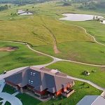 Panoramic view of a lush green golf course at Peoria Ridge Golf Course. Smooth