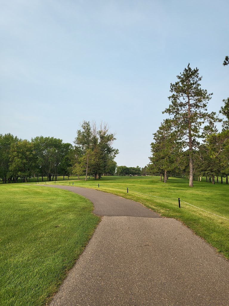 Panoramic view of a lush green golf course at Perham Lakeside Golf Course