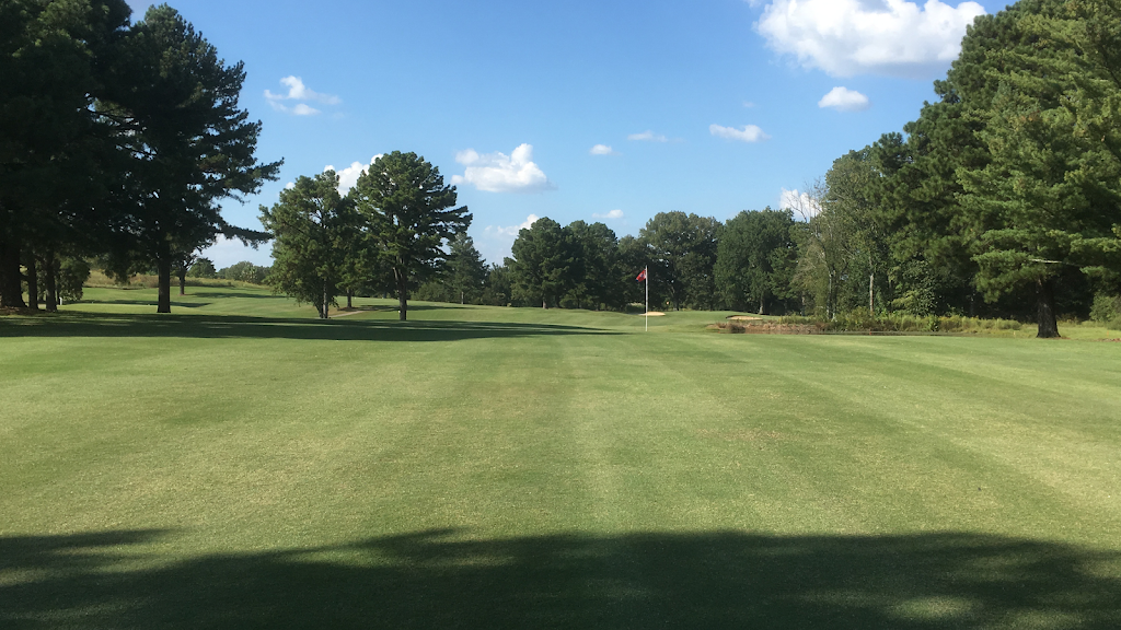 Panoramic view of a lush green golf course at Persimmon Hills Golf Course. Smooth