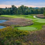 Panoramic view of a lush green golf course at Persimmon Woods Golf Club. Smooth