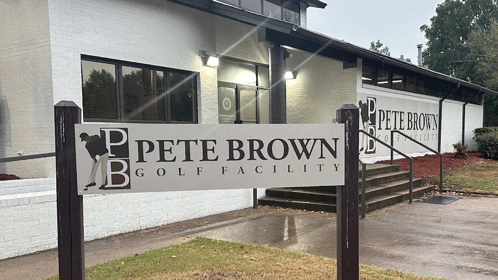 Panoramic view of a lush green golf course at Pete Brown Golf Facility. Smooth