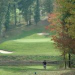 Panoramic view of a lush green golf course at Pheasant Ridge Golf Club. Smooth