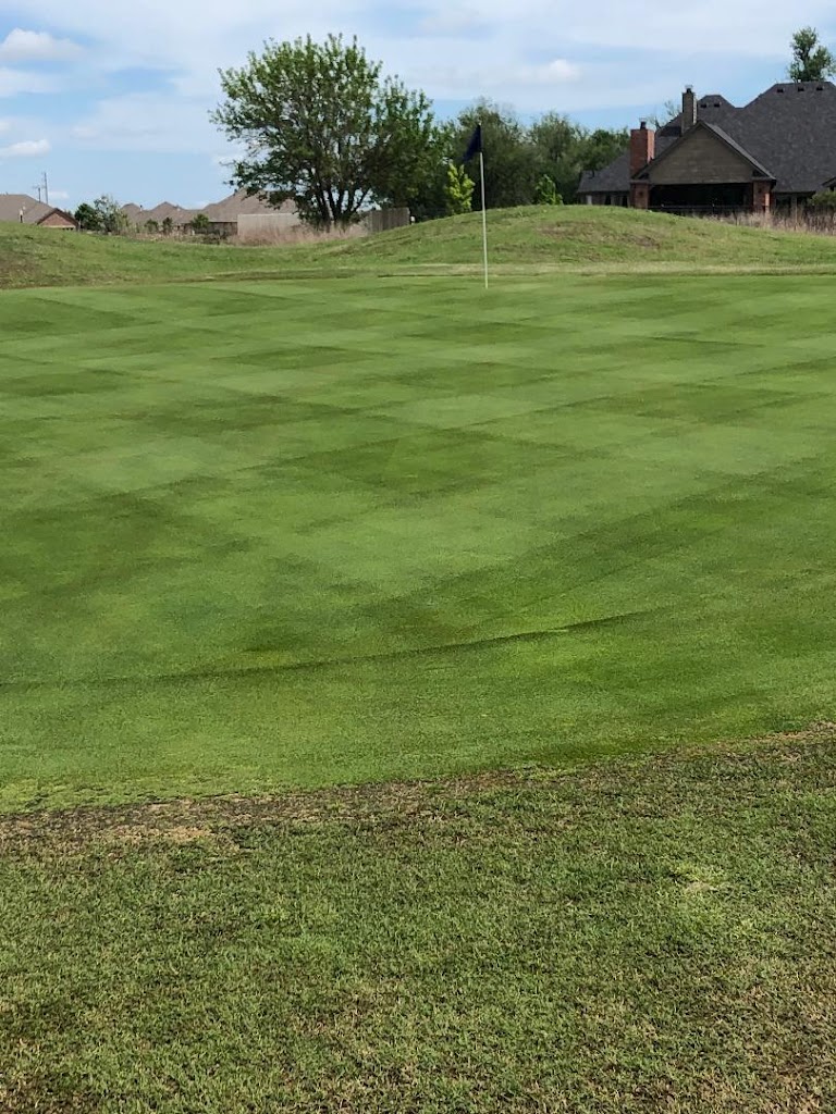 Panoramic view of a lush green golf course at Pheasant Run Golf & Grill. Smooth