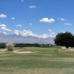 Panoramic view of a lush green golf course at Picacho Hills Country Club. Smooth