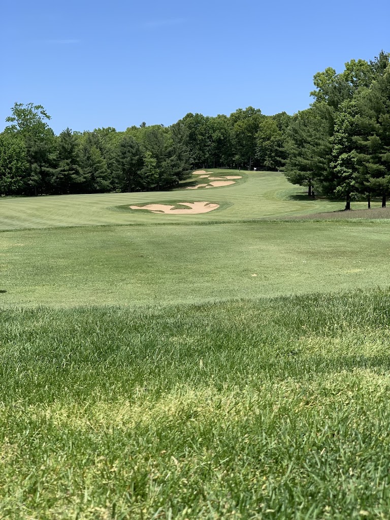 Panoramic view of a lush green golf course at Pilgrim's Run Golf Club. Smooth