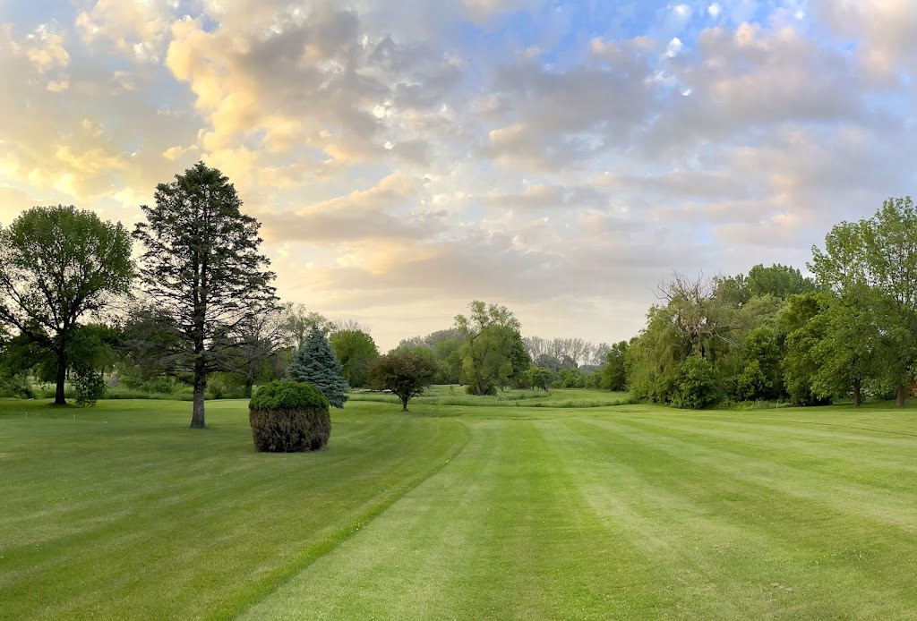 Panoramic view of a lush green golf course at Pine Creek Golf Club. Smooth