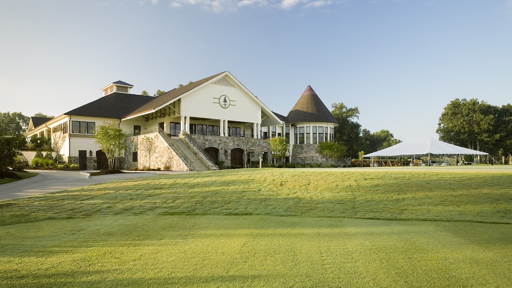 Panoramic view of a lush green golf course at Pine Island Country Club. Smooth