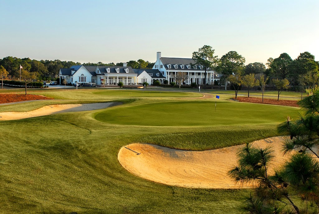 Panoramic view of a lush green golf course at Pine Lakes Country Club. Smooth