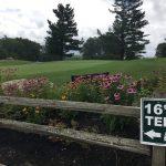 Panoramic view of a lush green golf course at Pine Ridge Country Club. Smooth