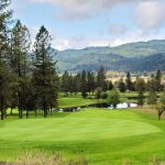 Panoramic view of a lush green golf course at Pine Ridge Golf Club. Smooth