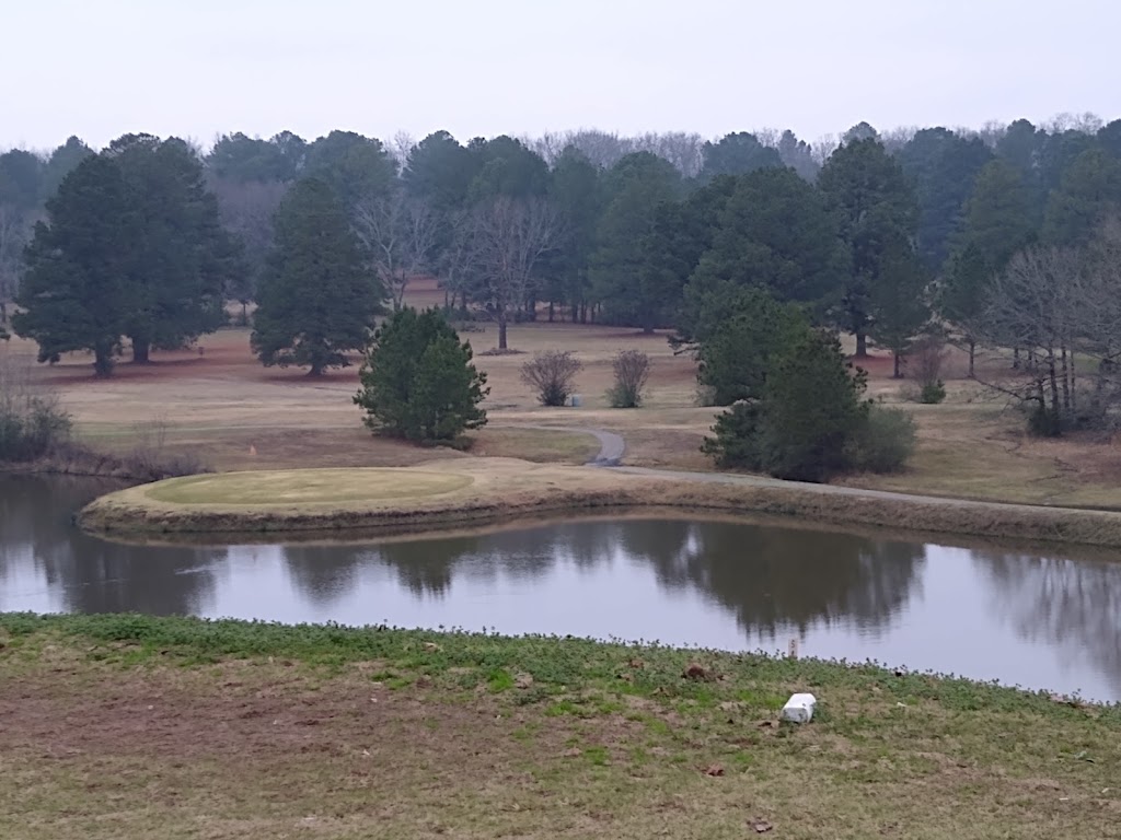 Panoramic view of a lush green golf course at Pine Valley Golf Course. Smooth