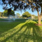 Panoramic view of a lush green golf course at Pinebrook Ironwood Golf Course. Smooth