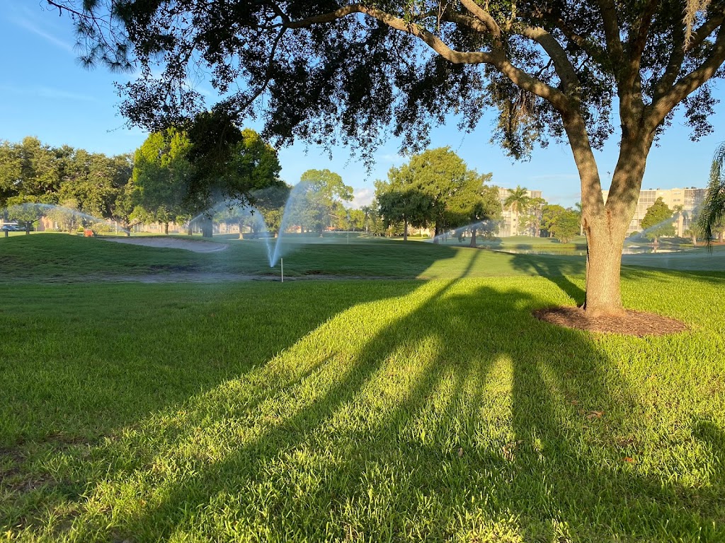 Panoramic view of a lush green golf course at Pinebrook Ironwood Golf Course. Smooth