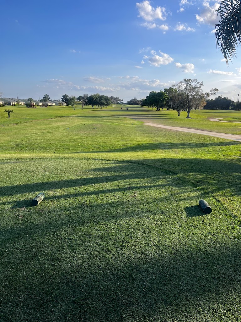 Panoramic view of a lush green golf course at Pinecrest Golf Club. Smooth