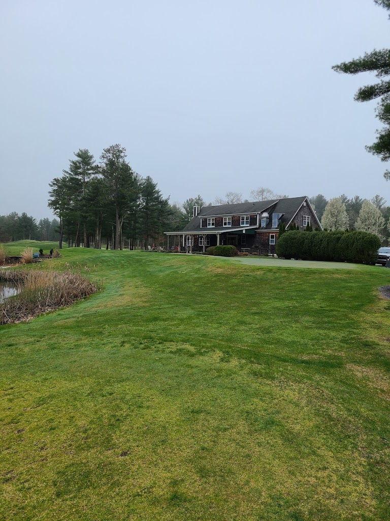 Panoramic view of a lush green golf course at Pinecrest Golf Course. Smooth