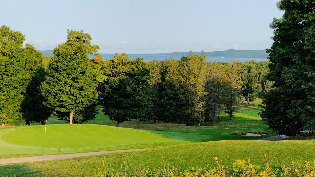 Panoramic view of a lush green golf course at Pinecroft Golf Course. Smooth