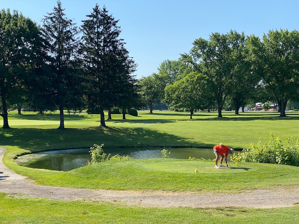 Panoramic view of a lush green golf course at Pines Golf Club. Smooth