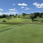 Panoramic view of a lush green golf course at Pittsburgh Field Club. Smooth