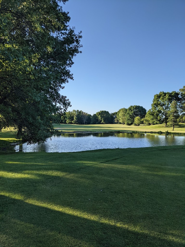 Panoramic view of a lush green golf course at Pleasant Valley Golf Course. Smooth