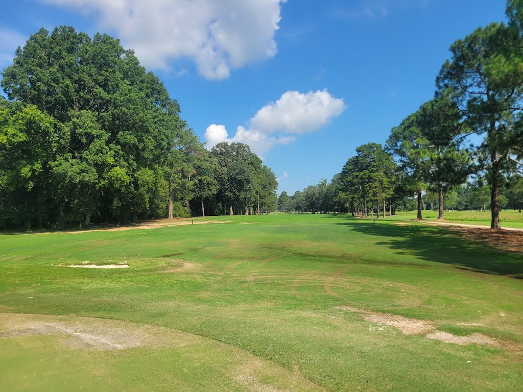 Panoramic view of a lush green golf course at Point Mallard Golf Course. Smooth