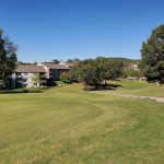 Panoramic view of a lush green golf course at Pointe Royale Golf Course. Smooth