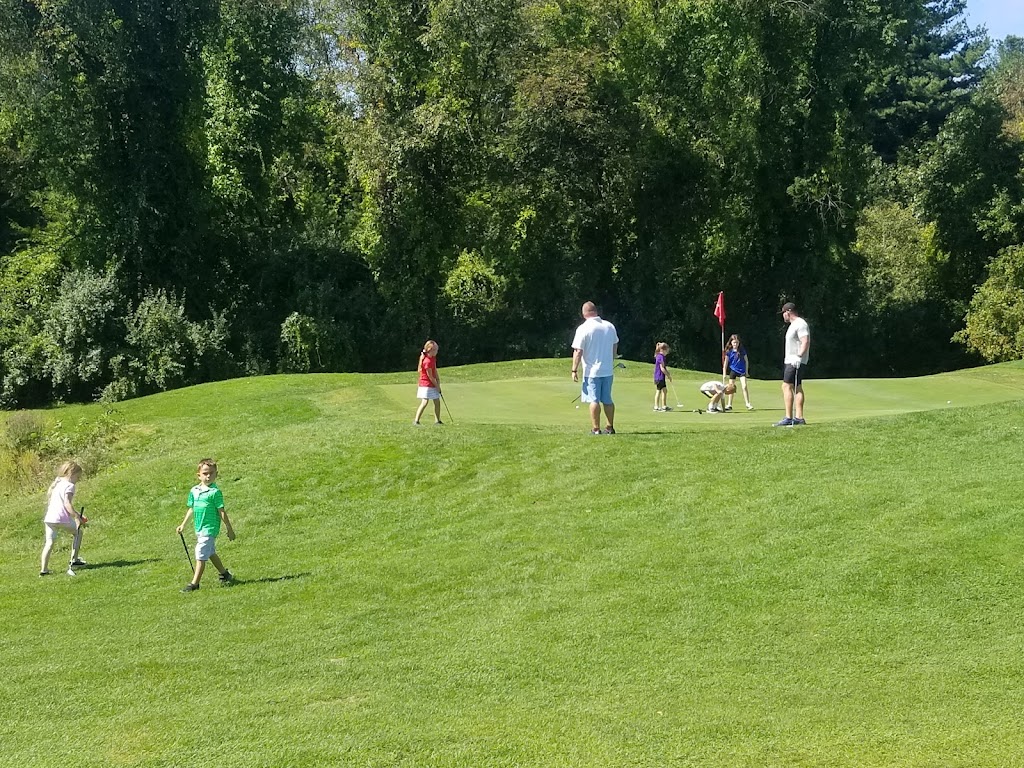 Panoramic view of a lush green golf course at Ponemah Green Family Golf Center. Smooth