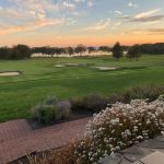 Panoramic view of a lush green golf course at Portland Country Club. Smooth