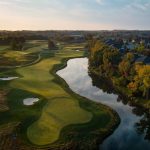 Panoramic view of a lush green golf course at Prairie Highlands Golf Club. Smooth