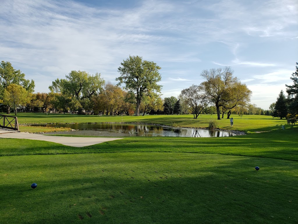 Panoramic view of a lush green golf course at Prairiewood Golf Course. Smooth