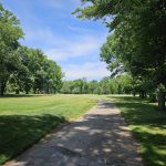 Panoramic view of a lush green golf course at Princeton Country Club. Smooth