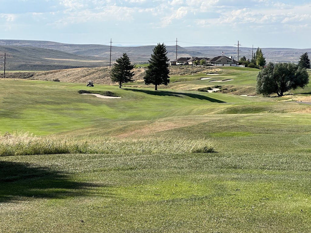 Panoramic view of a lush green golf course at Purple Sage Golf Course. Smooth