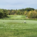 Panoramic view of a lush green golf course at Quail Ridge Golf Club. Smooth