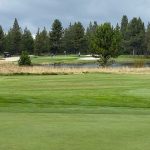 Panoramic view of a lush green golf course at Quail Run Golf Course. Smooth